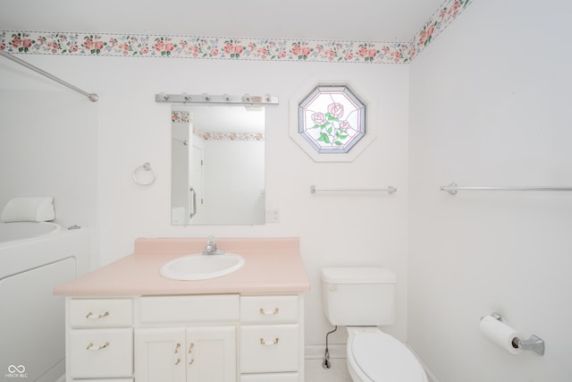 bathroom with vanity and toilet