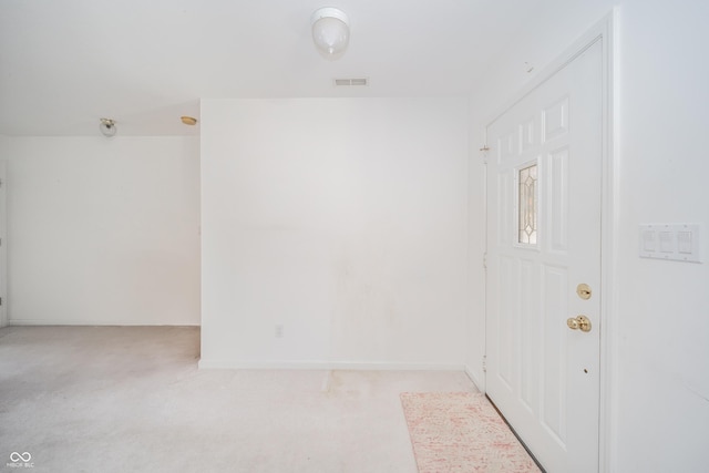 unfurnished room with light colored carpet