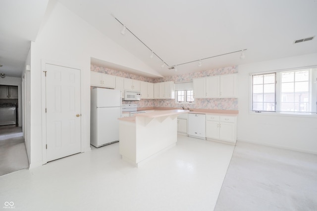 kitchen featuring a kitchen island, white cabinetry, lofted ceiling, decorative backsplash, and white appliances