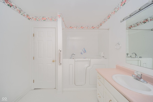 bathroom featuring vanity and a bathing tub