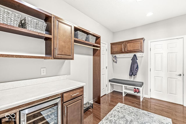 mudroom featuring wine cooler and dark hardwood / wood-style flooring