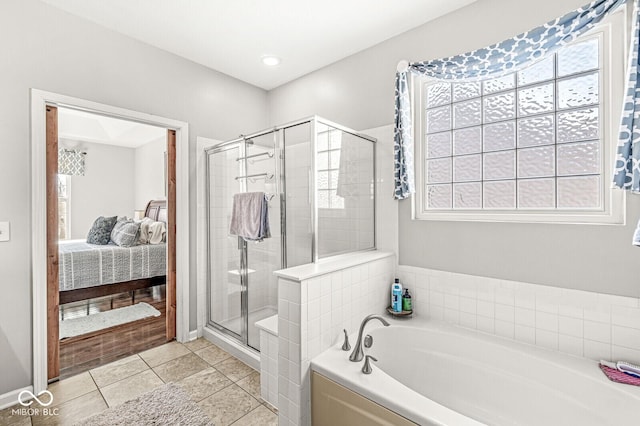 bathroom featuring tile patterned floors and independent shower and bath