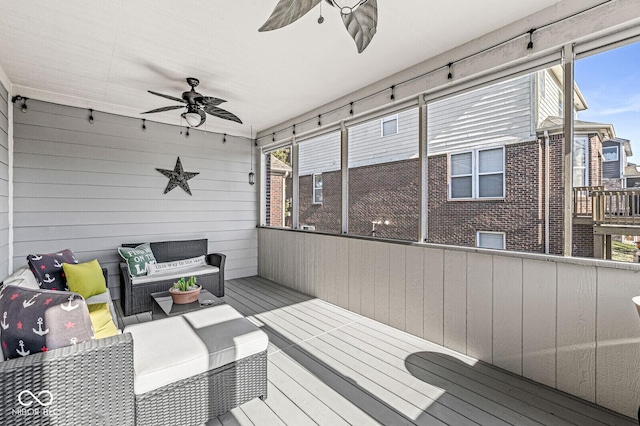 deck with an outdoor hangout area and ceiling fan