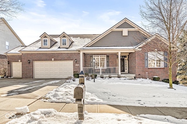 view of front of house featuring a porch and a garage