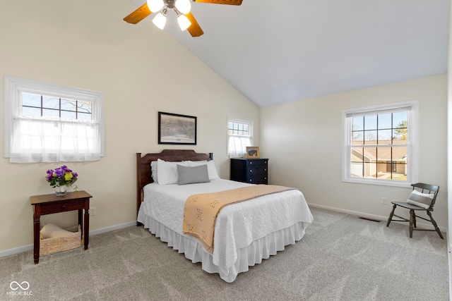 carpeted bedroom featuring high vaulted ceiling and ceiling fan