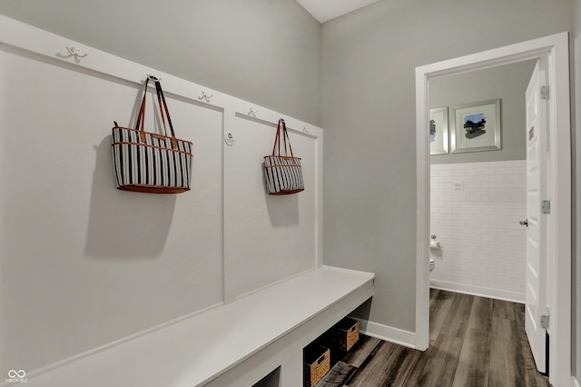 mudroom with tile walls and dark hardwood / wood-style flooring