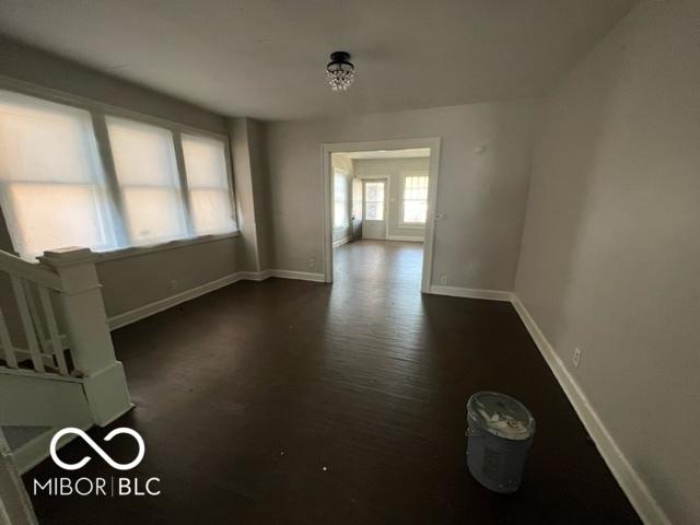 empty room featuring dark wood-type flooring