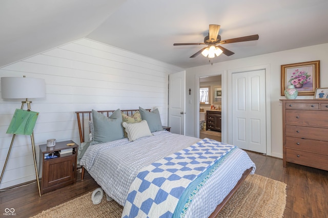 bedroom with lofted ceiling, dark hardwood / wood-style floors, and ceiling fan