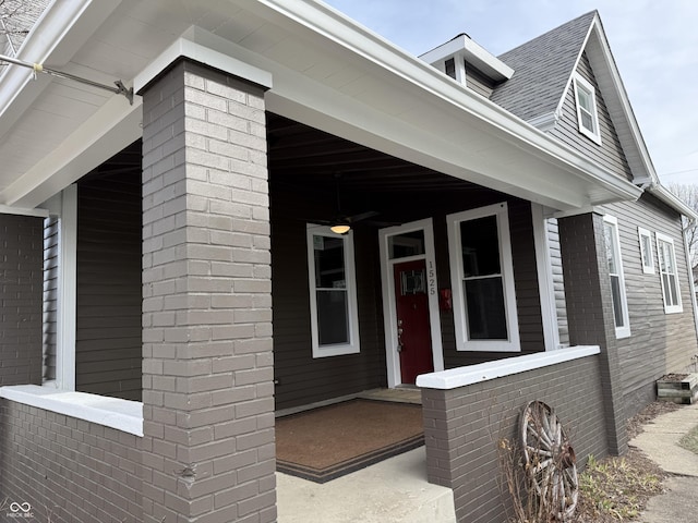 view of exterior entry with covered porch