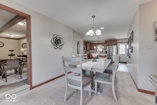 dining space with a chandelier