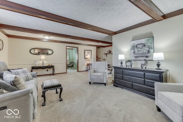 living room with beam ceiling, light carpet, and a textured ceiling