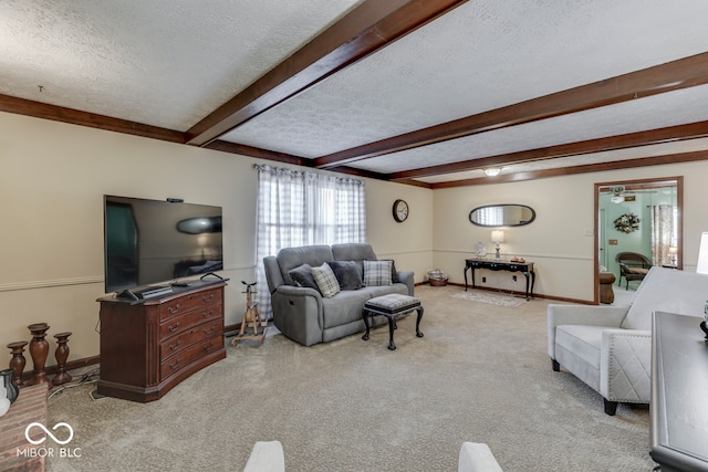 carpeted living room with beam ceiling and a textured ceiling