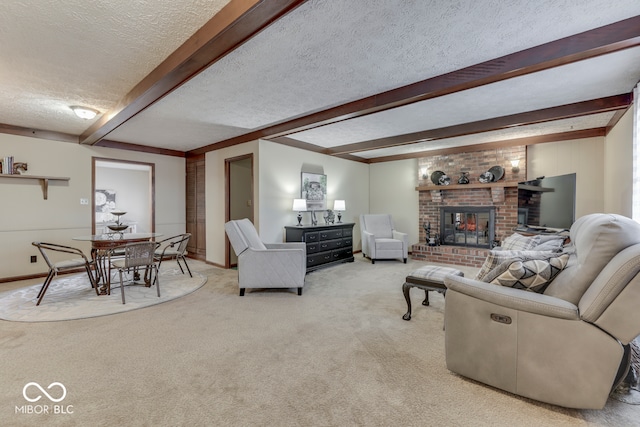 living room featuring beamed ceiling, a fireplace, light carpet, and a textured ceiling