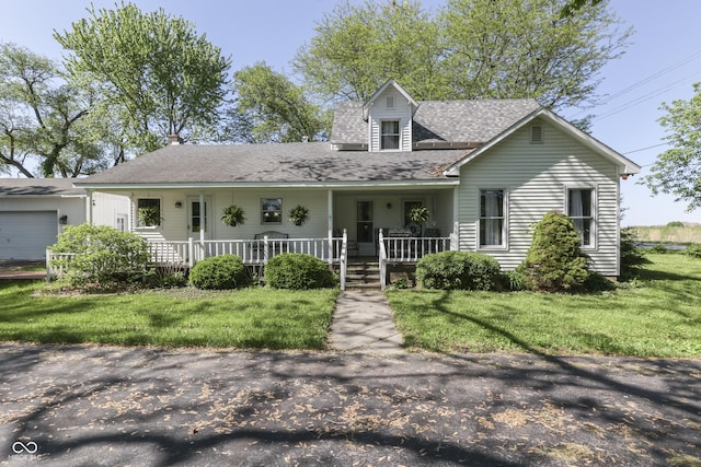 4462 S Morgantown Rd, Greenwood, IN 46143 - view of front of home featuring a porch, a front lawn, and a shingled roof