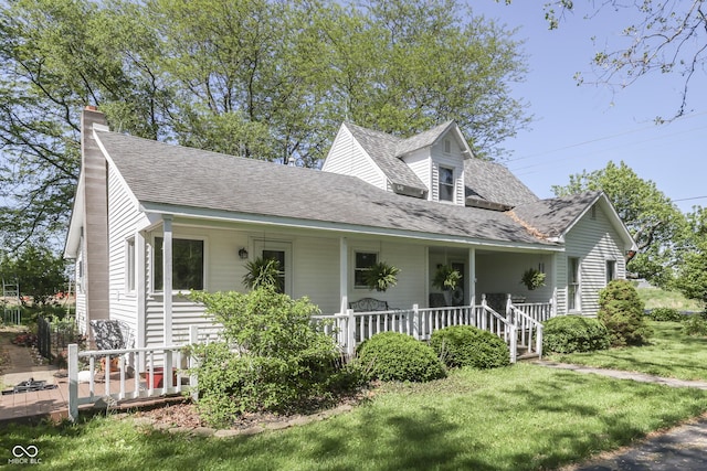 4462 S Morgantown Rd, Greenwood, IN 46143 - view of front of property with a porch, a shingled roof, a chimney, and a front lawn