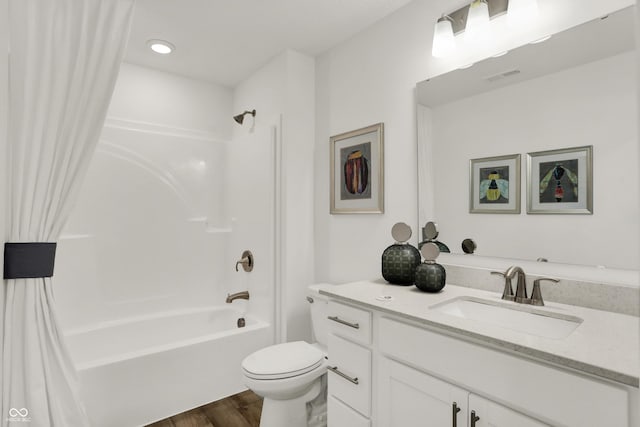 full bathroom with vanity, toilet, shower / tub combo, and hardwood / wood-style floors