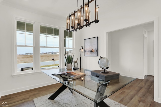 interior space with hardwood / wood-style flooring and a chandelier