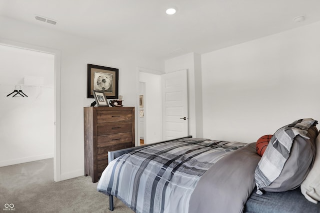 bedroom with light carpet