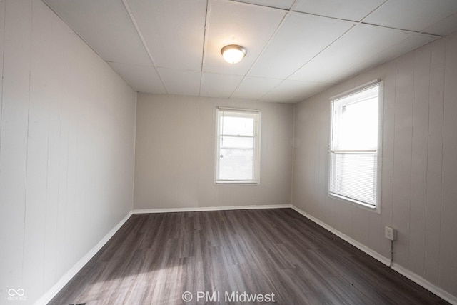 spare room featuring dark wood-type flooring