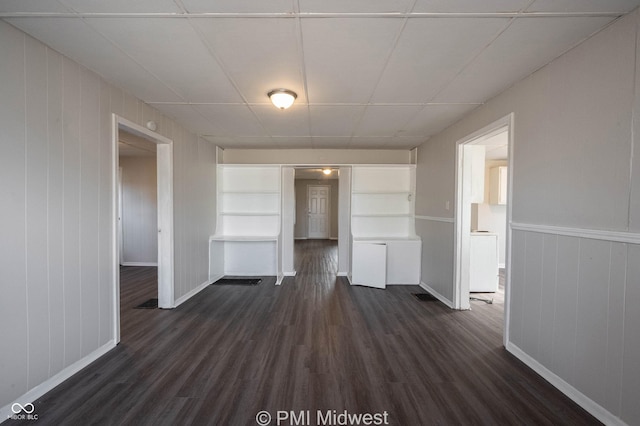 unfurnished living room with dark hardwood / wood-style floors