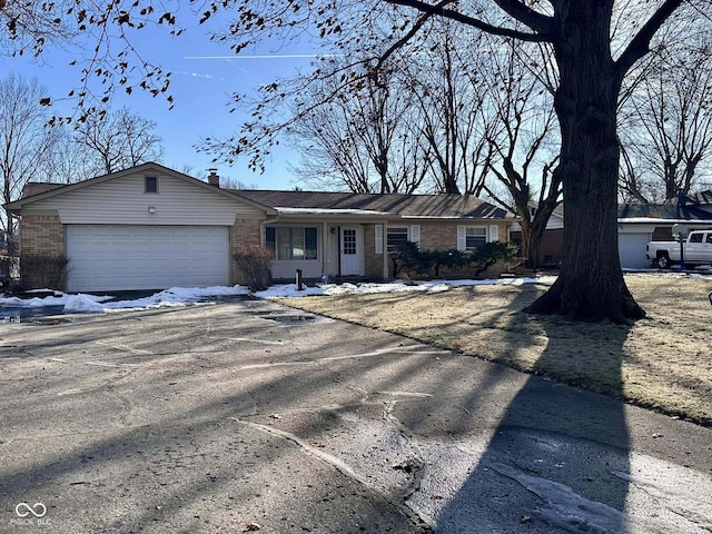 single story home with a garage