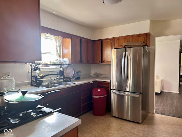 kitchen with sink and stainless steel fridge