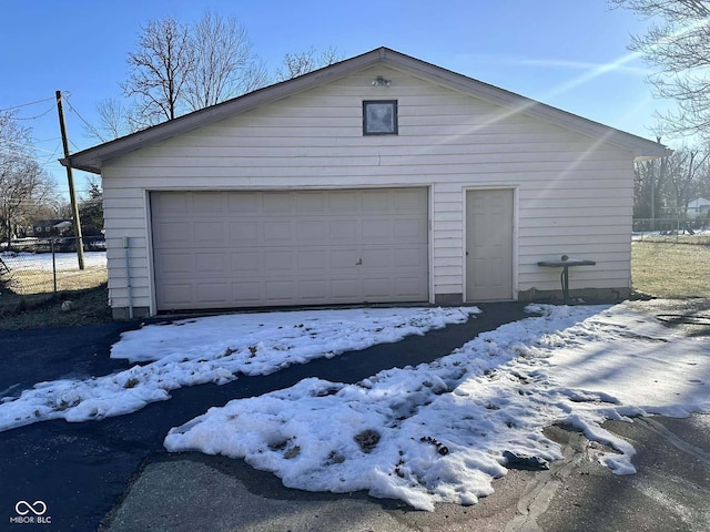 view of snow covered garage