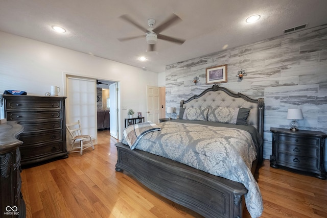 bedroom with ceiling fan and light wood-type flooring