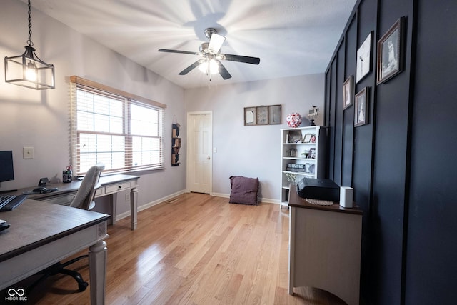 office space with ceiling fan and light wood-type flooring