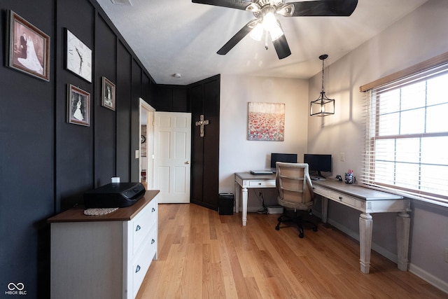 home office with ceiling fan and light wood-type flooring