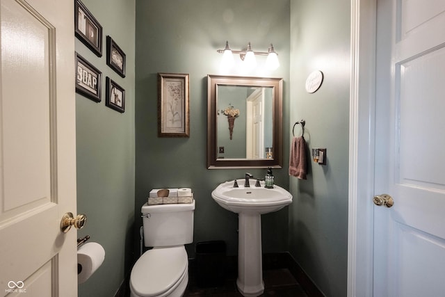 bathroom featuring sink and toilet