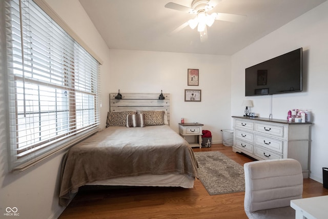 bedroom featuring hardwood / wood-style flooring and ceiling fan