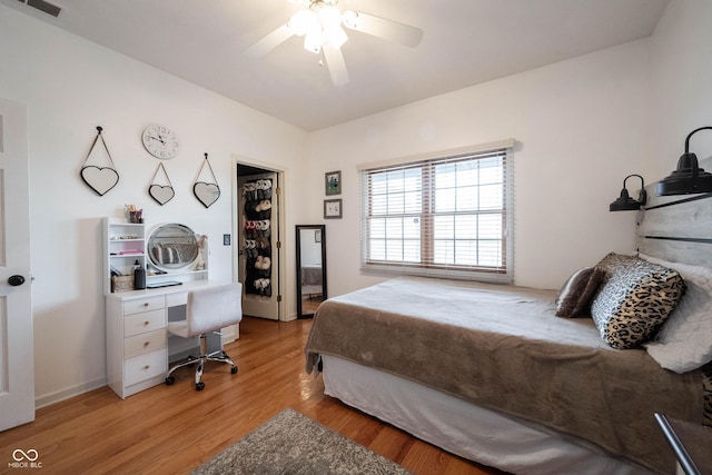 bedroom with hardwood / wood-style floors and ceiling fan