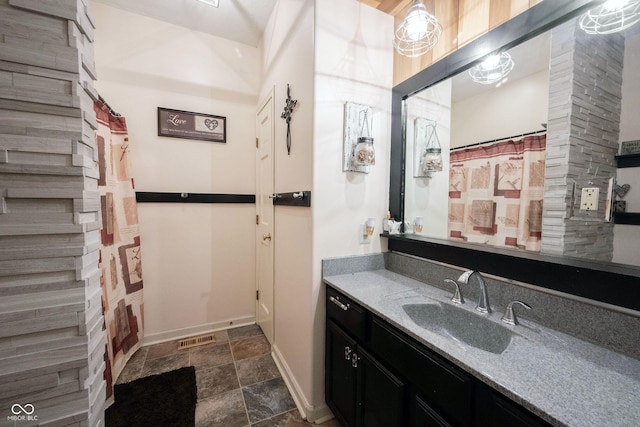 bathroom featuring vanity and a shower with shower curtain