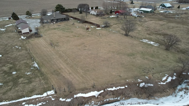 snowy aerial view with a rural view