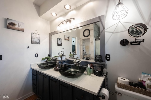 bathroom featuring vanity and toilet