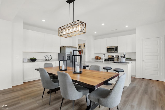 dining room with light wood-type flooring