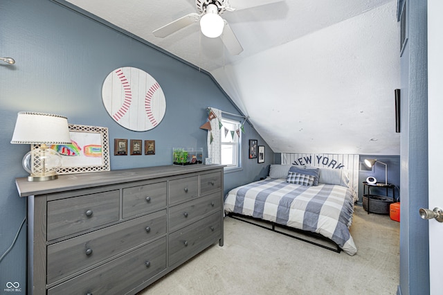 bedroom featuring light carpet, vaulted ceiling, and ceiling fan