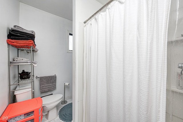 bathroom featuring curtained shower and tile patterned floors