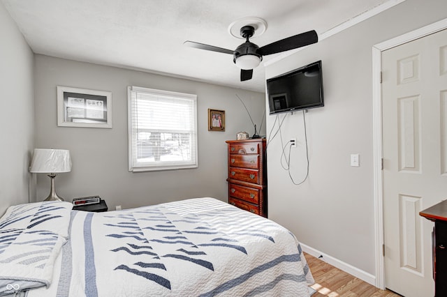 bedroom featuring ceiling fan and light hardwood / wood-style floors