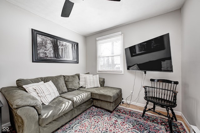 living room with hardwood / wood-style flooring and ceiling fan