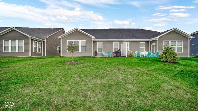 back of house with a yard and a patio area