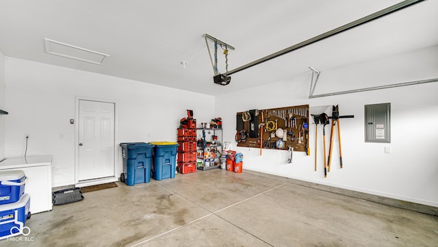 garage with a garage door opener and electric panel