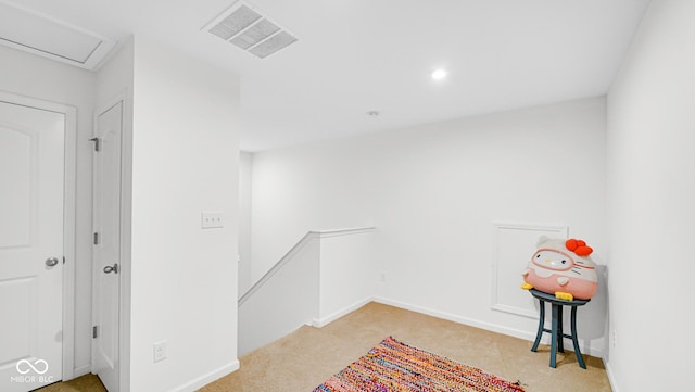 empty room featuring light colored carpet