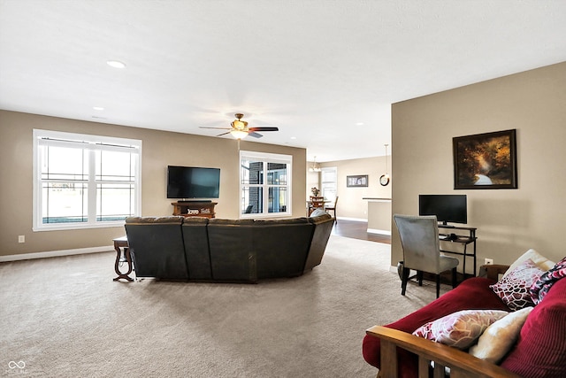 living room with carpet floors and ceiling fan