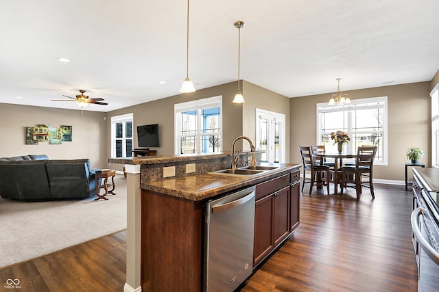 kitchen featuring pendant lighting, sink, dark wood-type flooring, and dishwasher