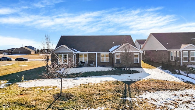 rear view of house with a yard