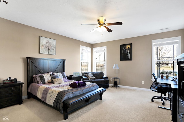 bedroom featuring light carpet and ceiling fan