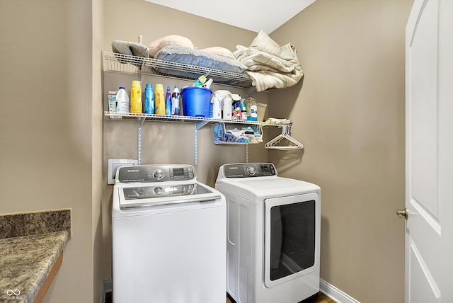 washroom featuring washing machine and dryer