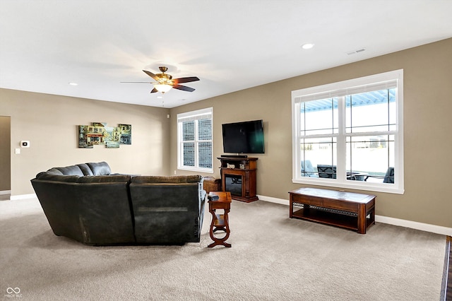 living room with carpet floors and ceiling fan